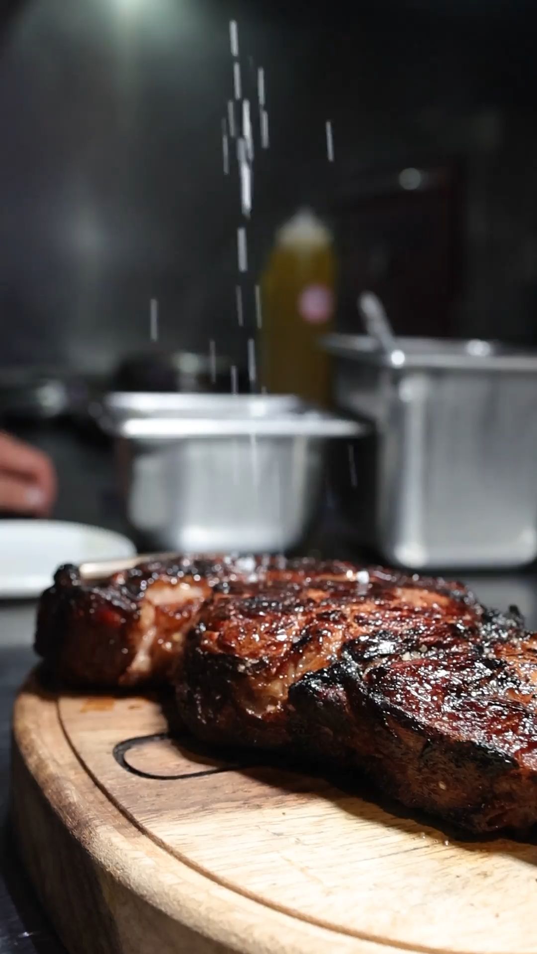 A plated beef course finished at the pass