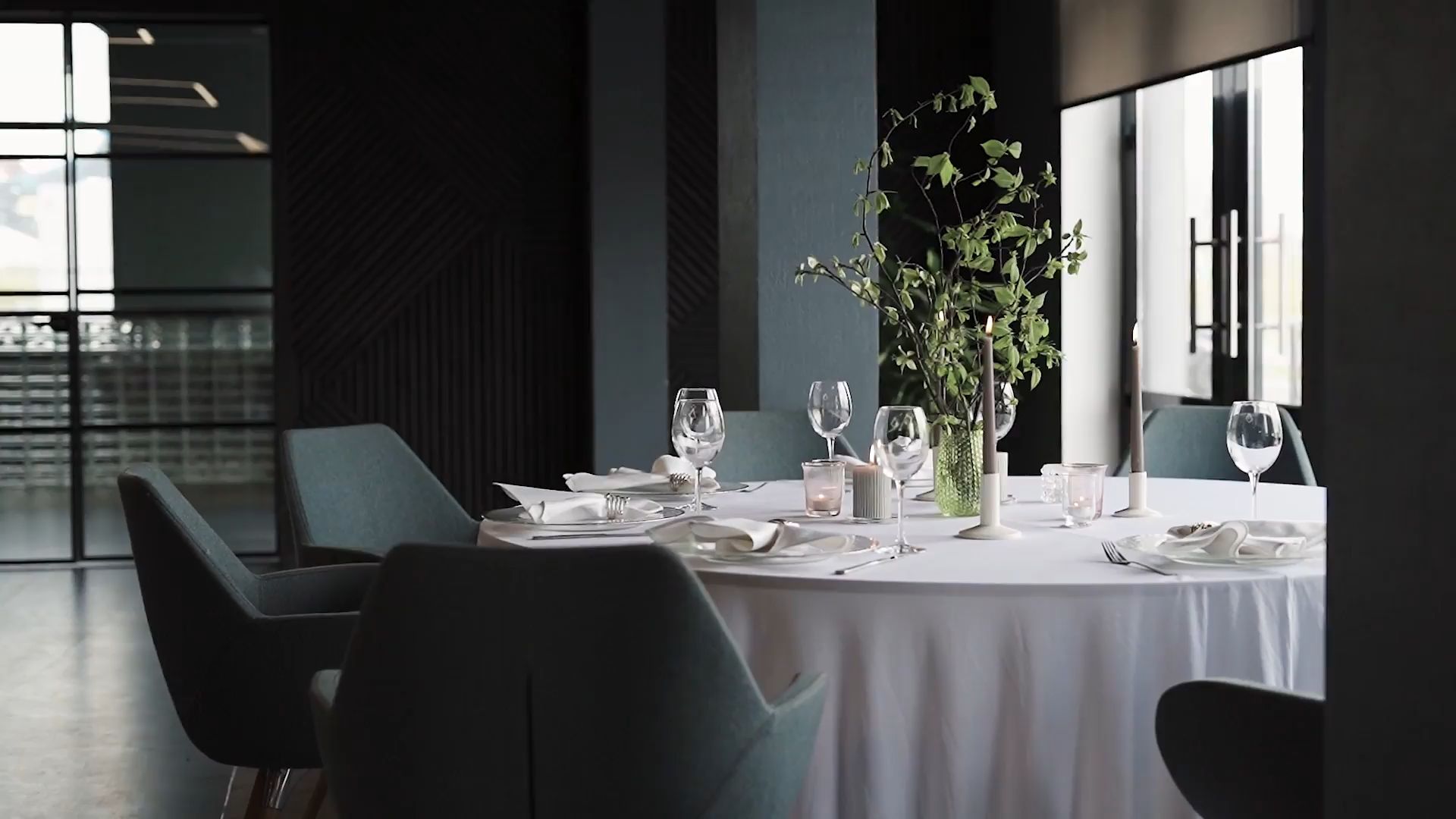 A dining room table laid and waiting for guests
